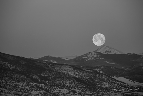 Moonset over Colorado mountains in Alamosa CO